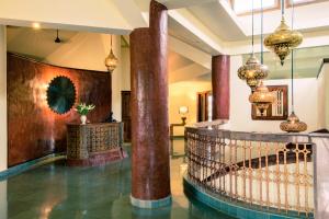 a lobby with columns and a staircase in a building at Argo by Trance in Dabolim