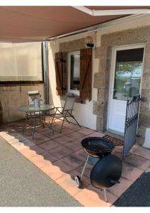 a patio with a table and chairs on a house at Swift Studio 