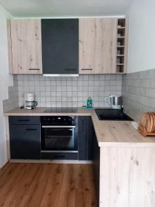 Kuchyň nebo kuchyňský kout v ubytování Bichlerhof