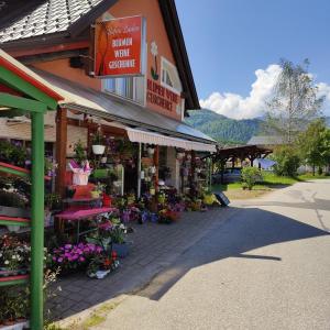 a store with flowers and plants on a street at Sofias Apartment in Bad Goisern