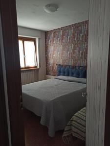 Postel nebo postele na pokoji v ubytování Appartamento spazioso con terrazzo di proprietà