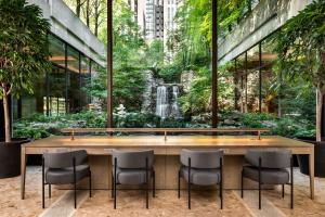 a table with chairs and a waterfall in a building at Sheraton Centre Toronto Hotel in Toronto