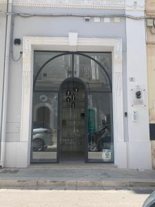 an entrance to a building with a revolving door at Donna Caterina in Monopoli