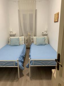 Postel nebo postele na pokoji v ubytování Ca' ToscaLina