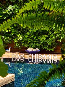 a sign for a pool at a dog clubhouse at DAR CHIBANIA in Marrakech