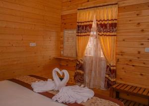 Voodi või voodid majutusasutuse Trinco Relax Hut toas