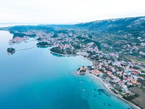 an aerial view of a small island in a body of water at Rab Pandelo Apartmani in Rab +44 photos