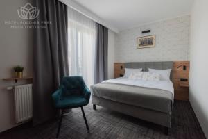 Postel nebo postele na pokoji v ubytování Hotel Polonia PARK Medical Center & Spa