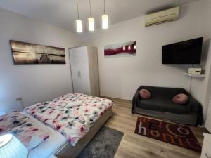 Postel nebo postele na pokoji v ubytování Studio Midtown