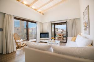 TV a/nebo společenská místnost v ubytování Casa Moazzo Suites and Apartments