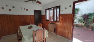 a dining room with a table and a ceiling fan at Casa Kuyay in San Salvador de Jujuy