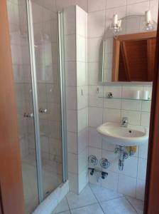 a bathroom with a shower and a sink at Gästehaus Hoffmann in Dörrenbach