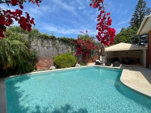 a swimming pool in the yard of a house at Studio with Private Swimming Pool and Garden in Cascais