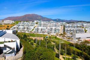 an aerial view of a city with white buildings at Gorgeous views close to Marina! in Estepona