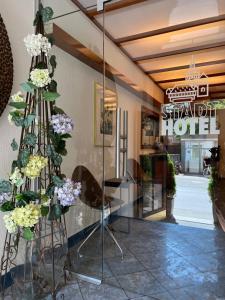 a lobby of a hotel with a display of flowers at Stadthotel in Konstanz