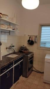 A kitchen or kitchenette at Amazing 1BR by the Tel Aviv Port