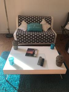 a white coffee table with a couch in a living room at EXCEPTIONNEL "A NOUS PARIS" ! Spacieux - Calme - Balcon - Wifi - Netflix - Parking in Rueil-Malmaison