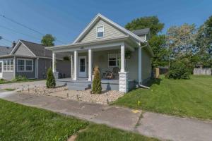 a small green house with a lawn in front of it at Home 15 min from Starved Rock and Chicago Skydive! in Ottawa