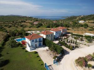 an aerial view of a villa with a resort at Iridia Resort Villas in Foiníki