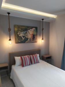 A bed or beds in a room at Studios Periklis