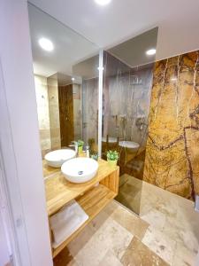 a bathroom with two sinks and a shower at Astria Boutique Apartments 301 in Olimp