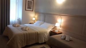 Postel nebo postele na pokoji v ubytování Hotel Corallo