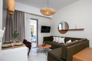 a living room with a couch and a table at Pachis Escape Suites in Pachis