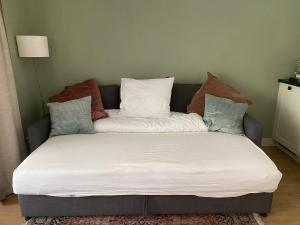 מיטה או מיטות בחדר ב-Appartement Osso Arnhem