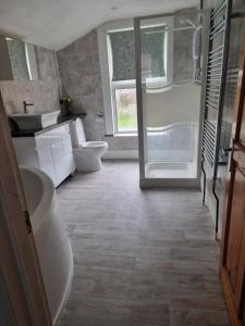 a bathroom with a toilet and a sink at Margate Town House in Kent