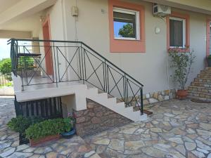 a staircase on the side of a house at limonchello 2 in Kalamata