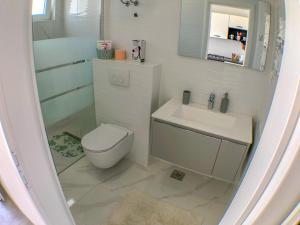 Kúpeľňa v ubytovaní Apartmani Doris
