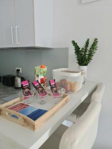 a table with wine glasses on top of it at BRAND NEW lovely apartment Bella in Dubrovnik