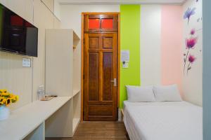 Postel nebo postele na pokoji v ubytování HOTEL NẮNG CHIỀU ĐÀ LẠT