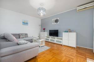 TV a/nebo společenská místnost v ubytování Dea B4+1