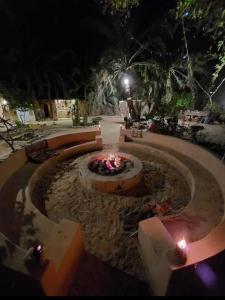 a fire pit in a park at night at كامب طموسي in Siwa