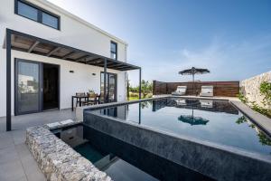 a swimming pool in the backyard of a house at Campo Premium Stay Private Pool Villas in Kos Town