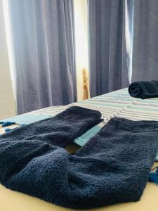 Postel nebo postele na pokoji v ubytování Lassion Hotel