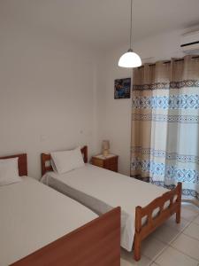 Postel nebo postele na pokoji v ubytování Kassandra Garden Residence