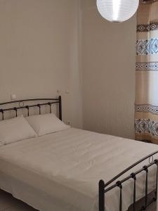 Postel nebo postele na pokoji v ubytování Kassandra Garden Residence