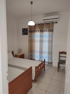 Postel nebo postele na pokoji v ubytování Kassandra Garden Residence