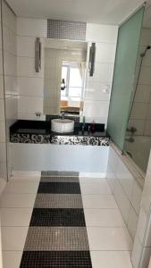 a bathroom with a sink and a mirror at داماك الكورنيش جدة الجناح الذهبي Damac tower jeddah in Jeddah +13 photos
