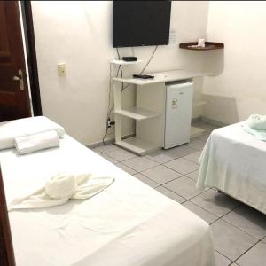 Cama o camas de una habitación en Pousada Palmeiras