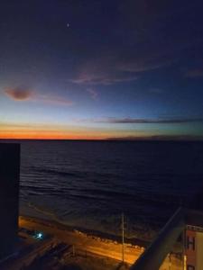 a view of the ocean at night at Apartment in Atacames in Atacames