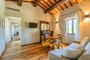 a living room with a couch and a table at Agriturismo Colli Martani in Massa Martana