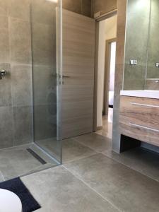 a bathroom with a shower and a sink at Ulika Novalja in Novalja +34 photos