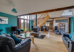 a living room with a couch and a fireplace at Noyadd in Builth Wells