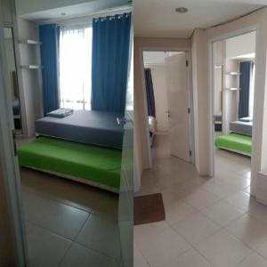 a bedroom with a bed and a room with a window at Apartemen Altiz Bintaro J in Mencil