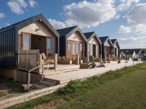 a row of modular homes in a row at Beachside chalet 3 Cormorant with access to beach in Cowes