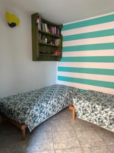 Posteľ alebo postele v izbe v ubytovaní Appartamento Picasso