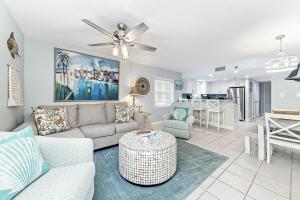 a living room with a couch and a table at Clearwater 1D in Gulf Shores
